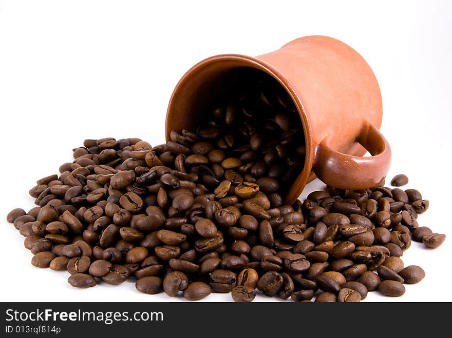 Roasted coffee and cup, white background. Roasted coffee and cup, white background.