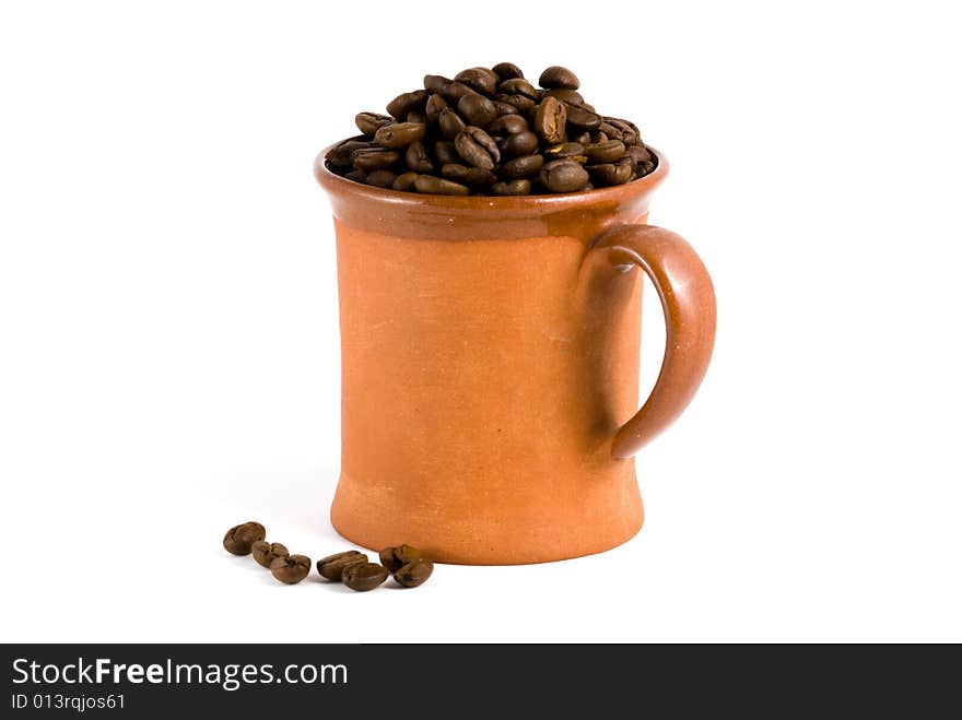 Roasted coffee and cup, white background. Roasted coffee and cup, white background.