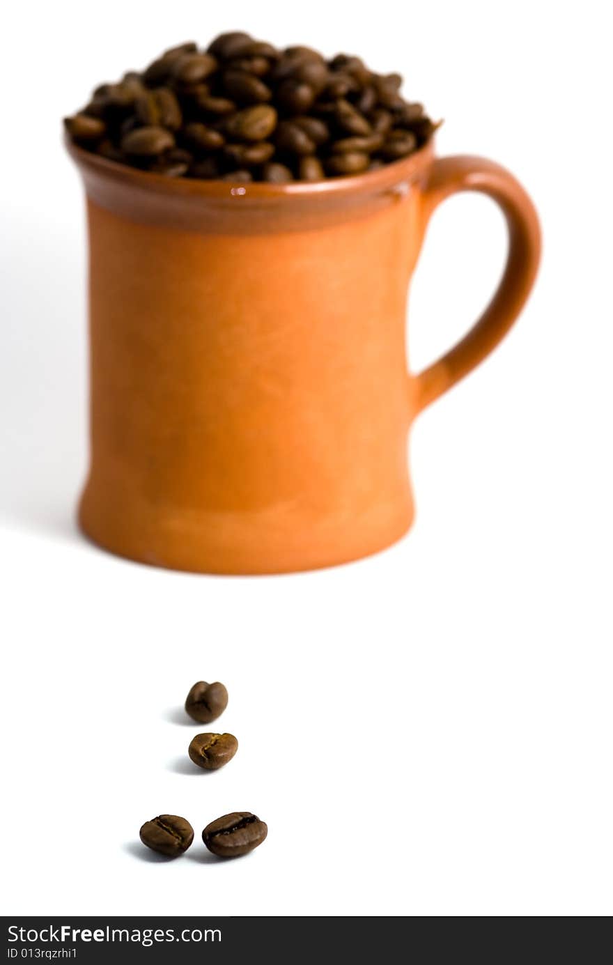 Roasted coffee and cup, white background. Roasted coffee and cup, white background.