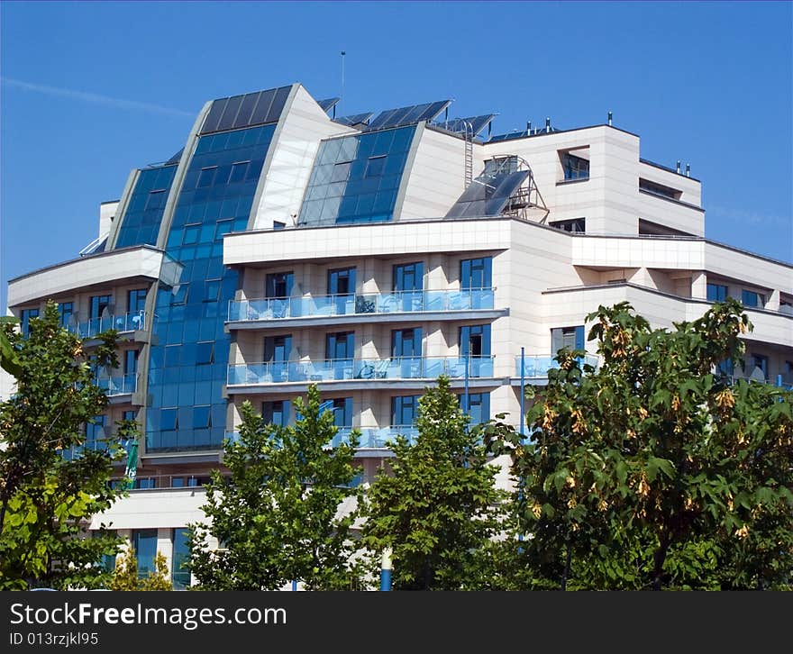 Modern blue building and green trees. Modern blue building and green trees