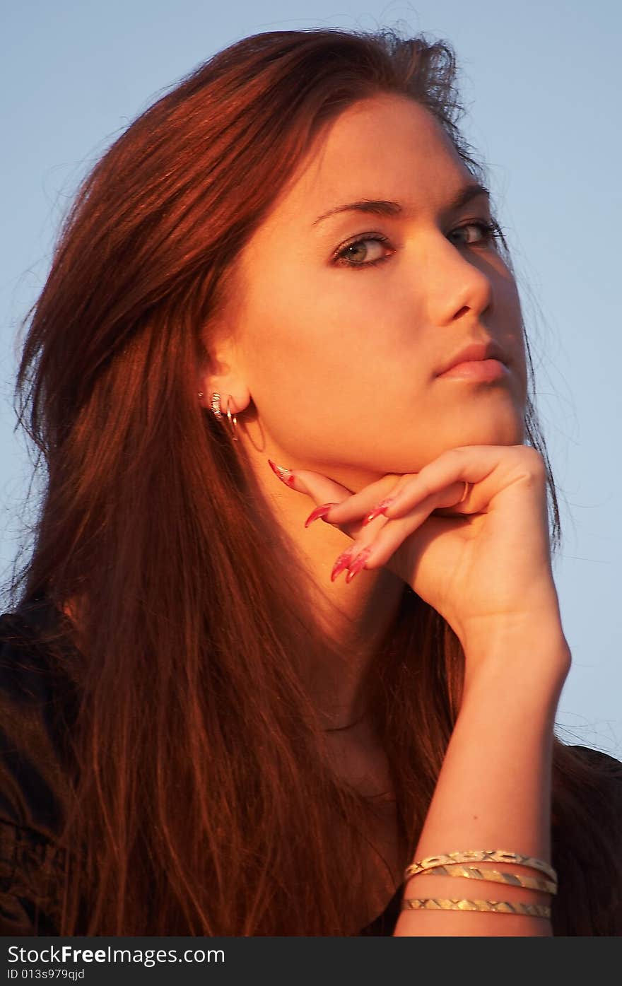 Portrait of a young lady in light of the evening sun