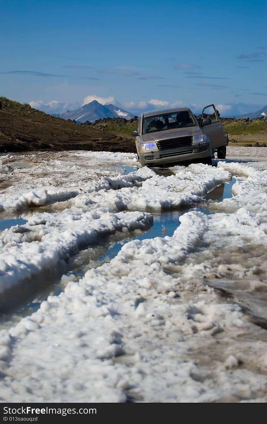 Allroad car overcome a snowfield in Kamchatka.