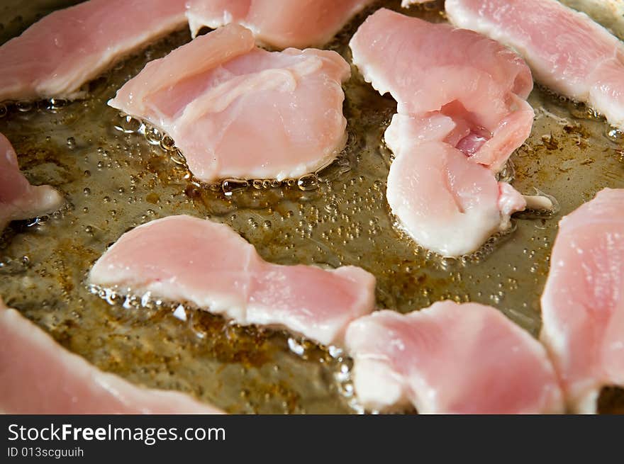 Raw fresh turkey meat on a frying pan. Raw fresh turkey meat on a frying pan