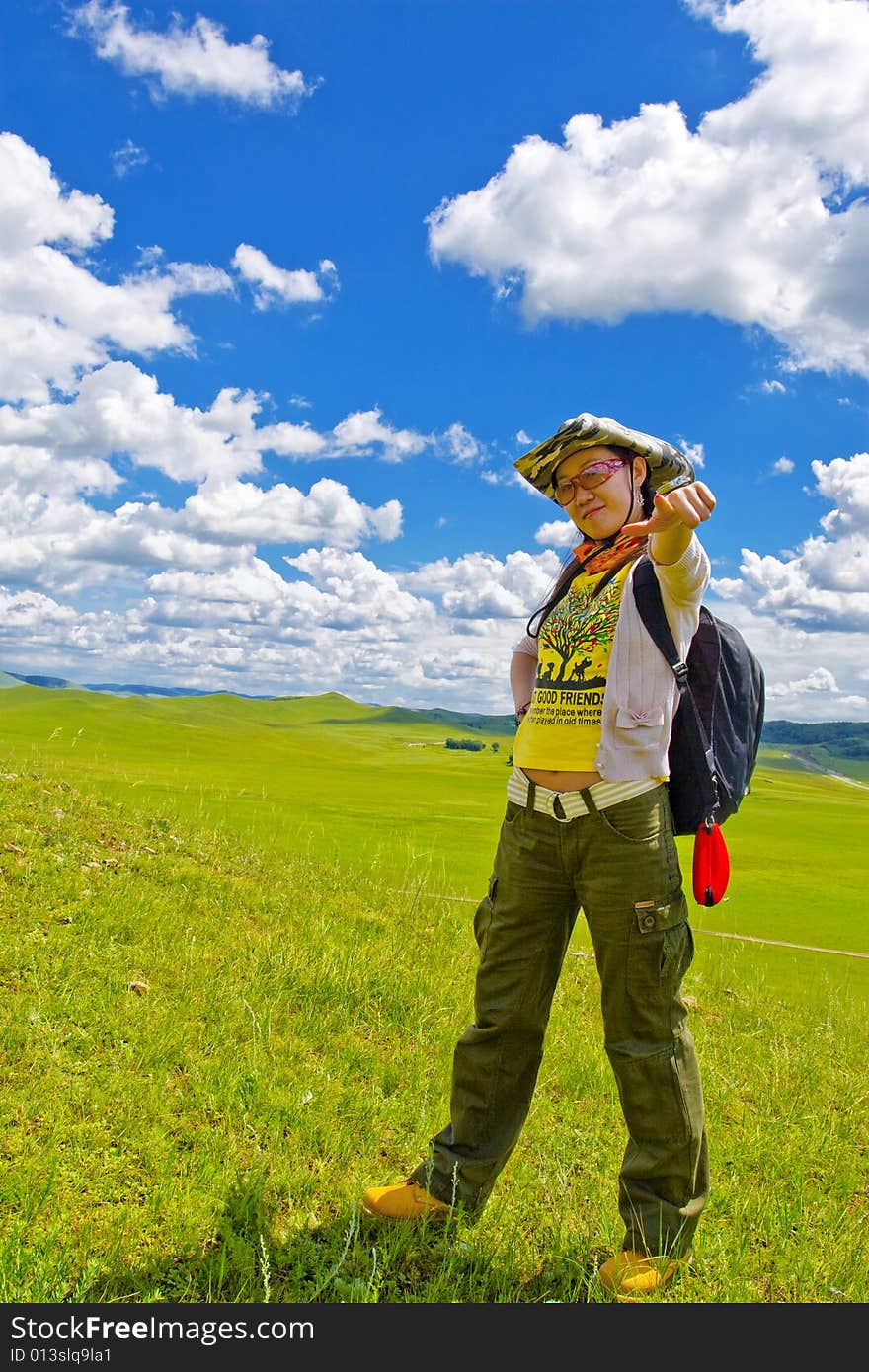 Happy girl on meadow,sky