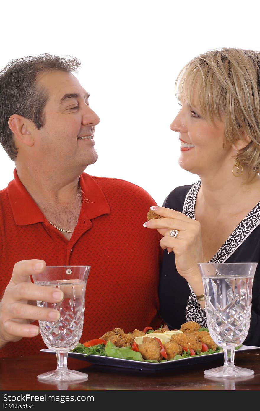 Couple having snacks isolated on white