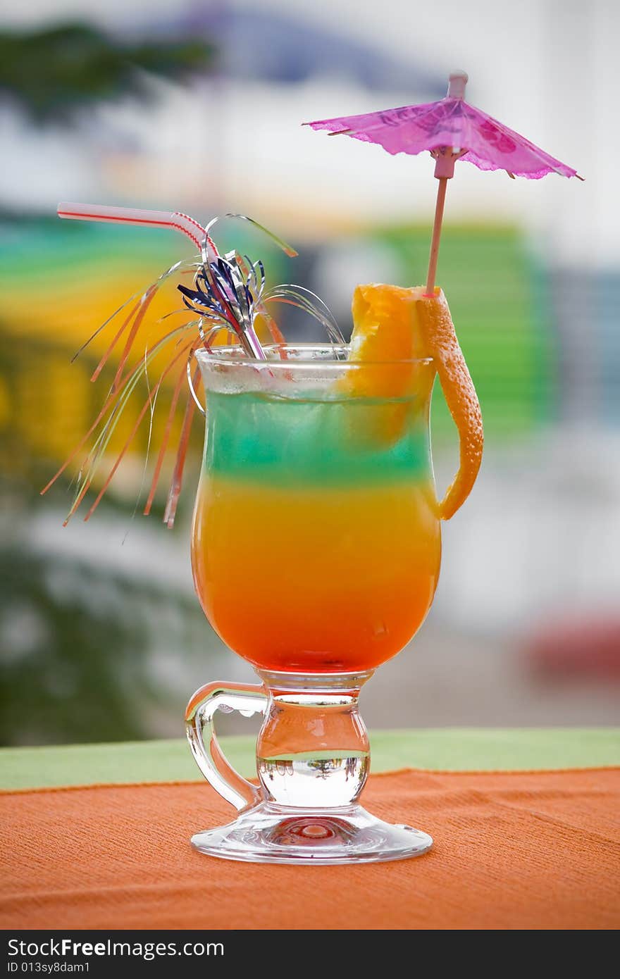 Colored cocktail with orange slice