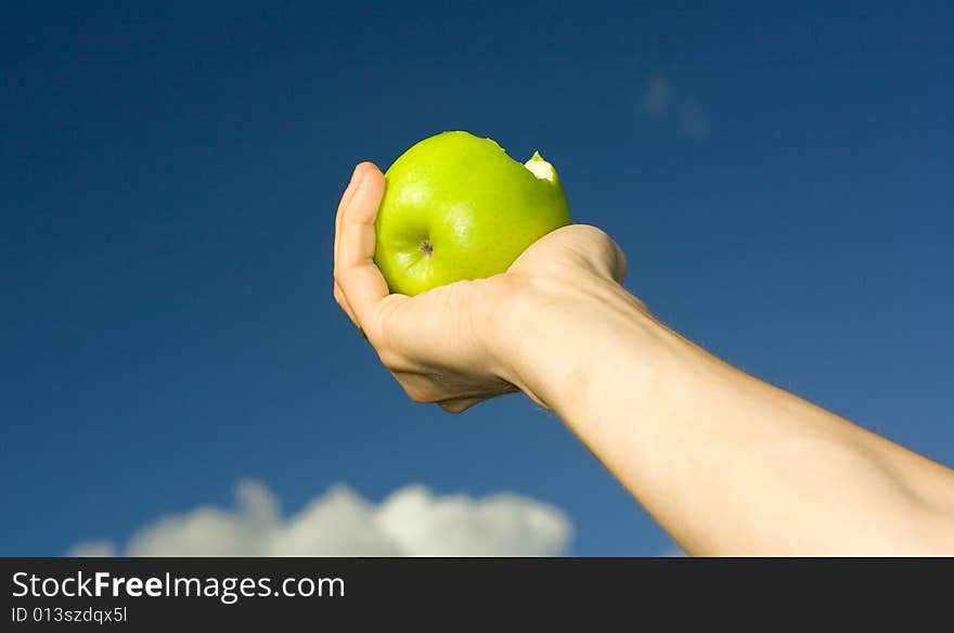 Green apple on man's hand. Green apple on man's hand