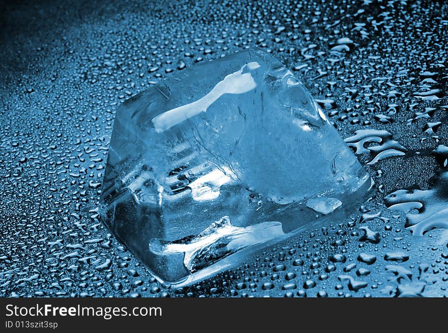 The melting ice cubes with drops