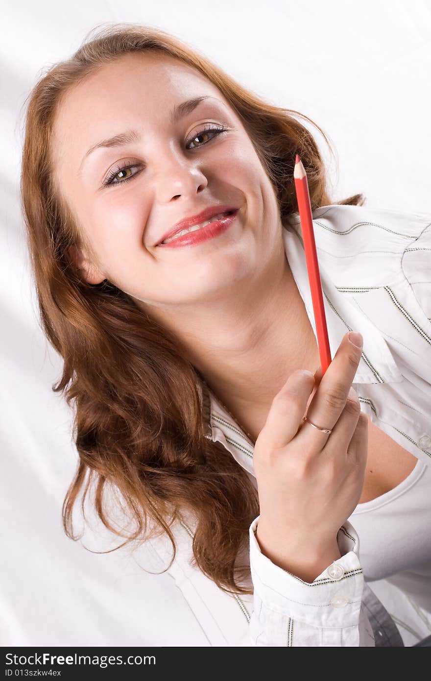 Beautiful girl posing with crayon. White background. #1. Beautiful girl posing with crayon. White background. #1