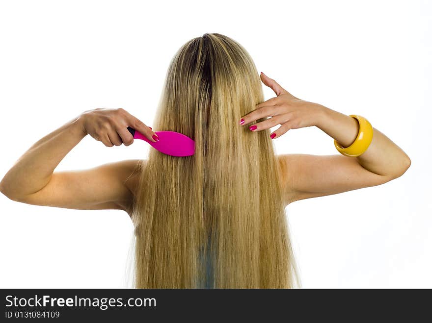 Long hair blonde woman with hairbrush in her hand. Long hair blonde woman with hairbrush in her hand