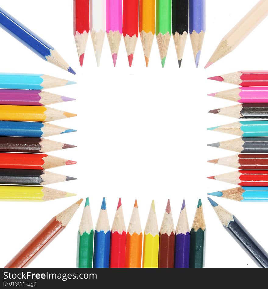 Colored pencils form a square white space in center. Colored pencils form a square white space in center