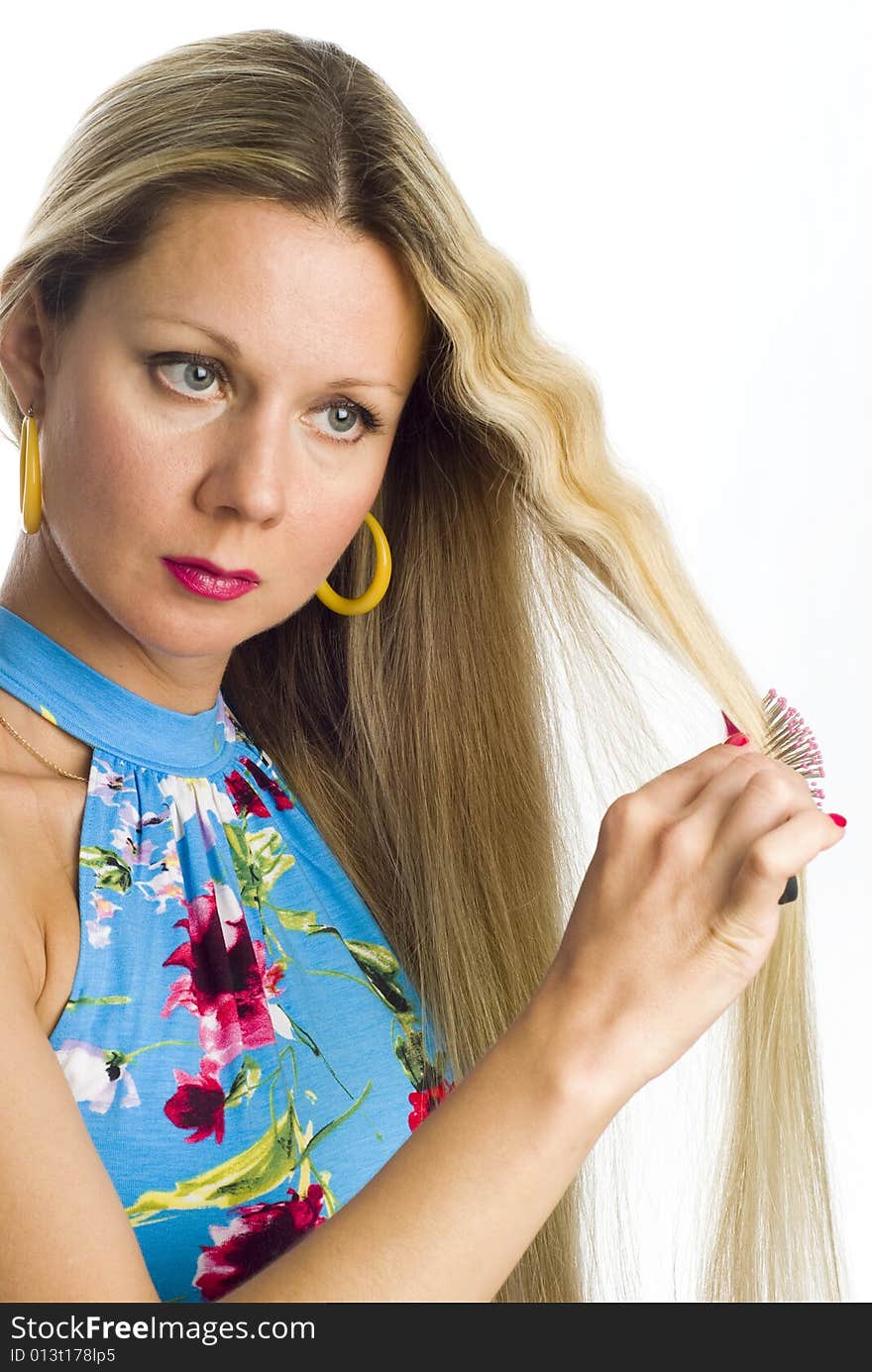 Long hair blonde woman with hairbrush in her hand. Long hair blonde woman with hairbrush in her hand