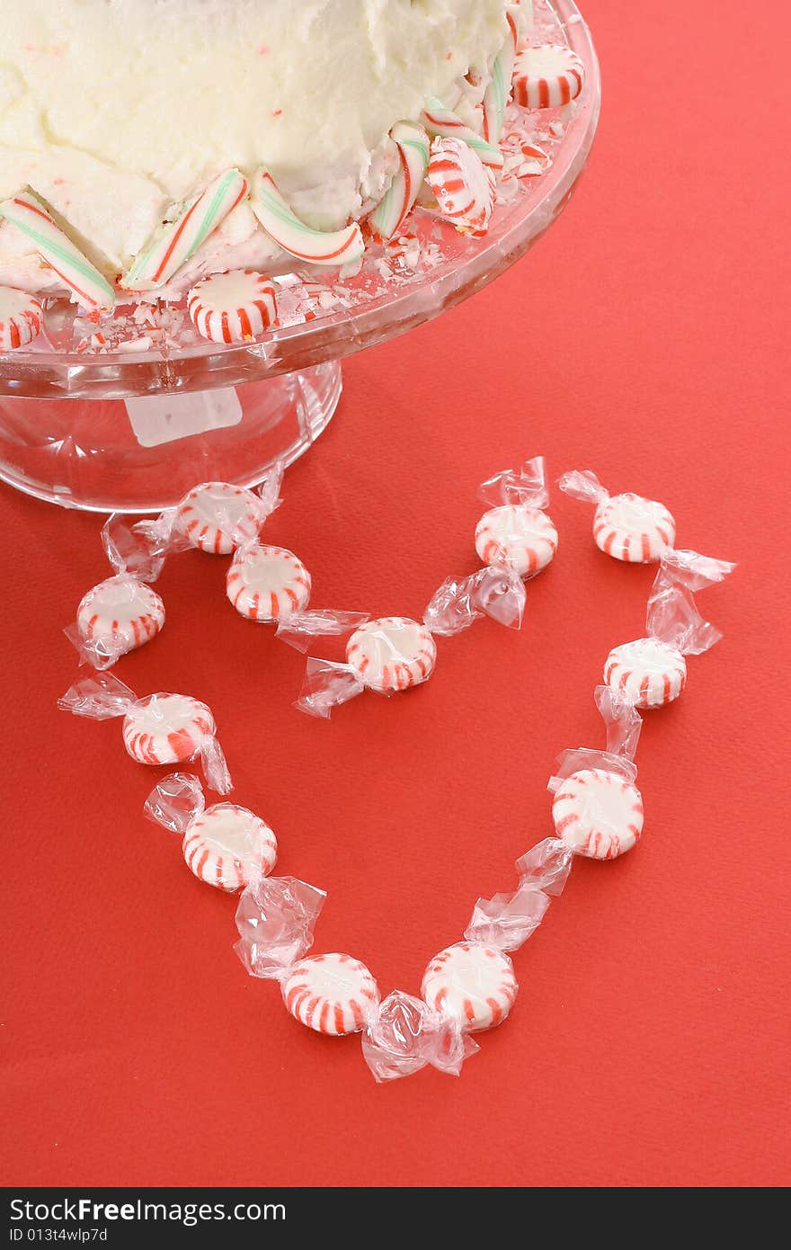 Peppermint heart with cake isolated on white