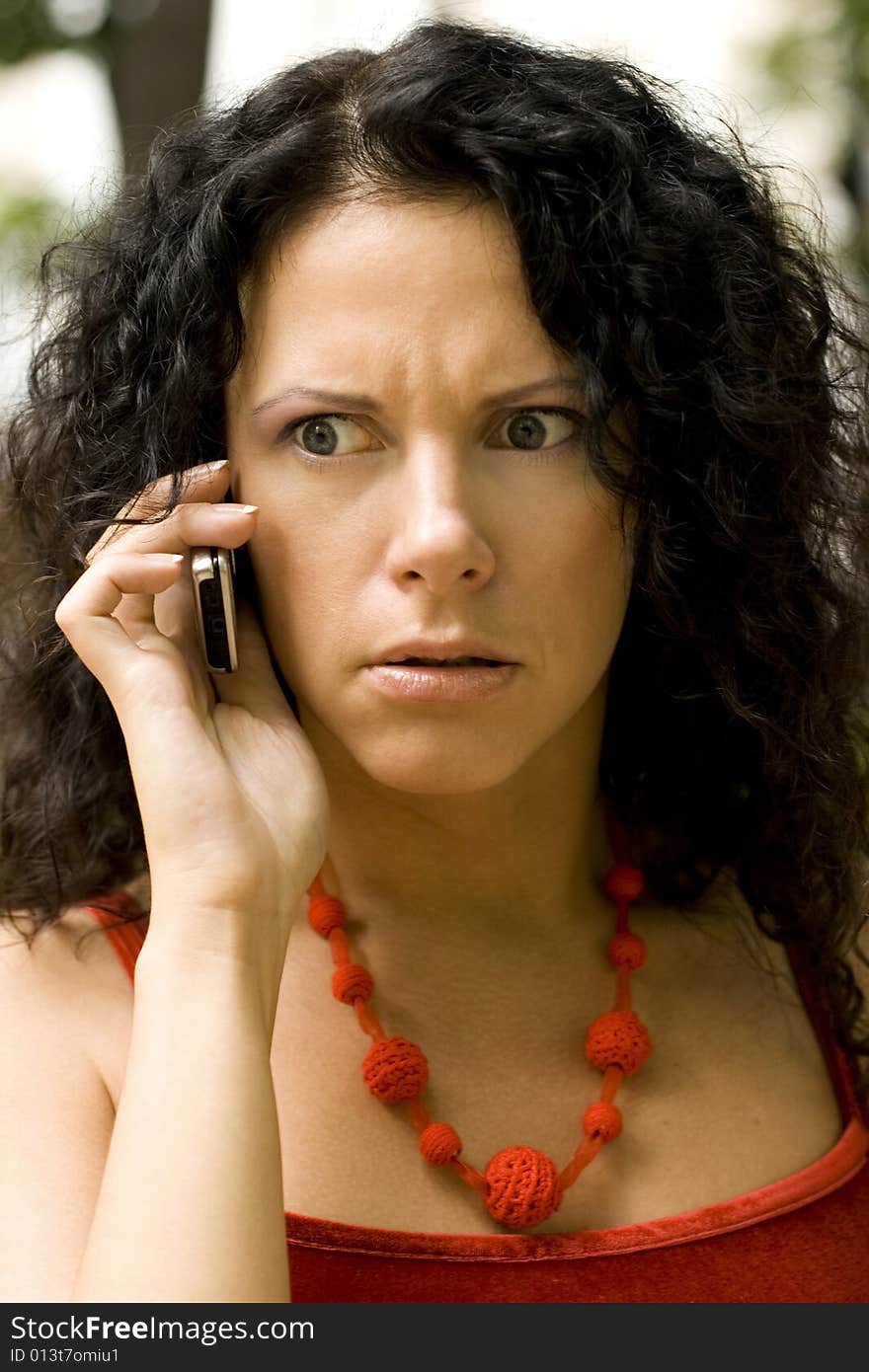 Woman on phone getting bad news