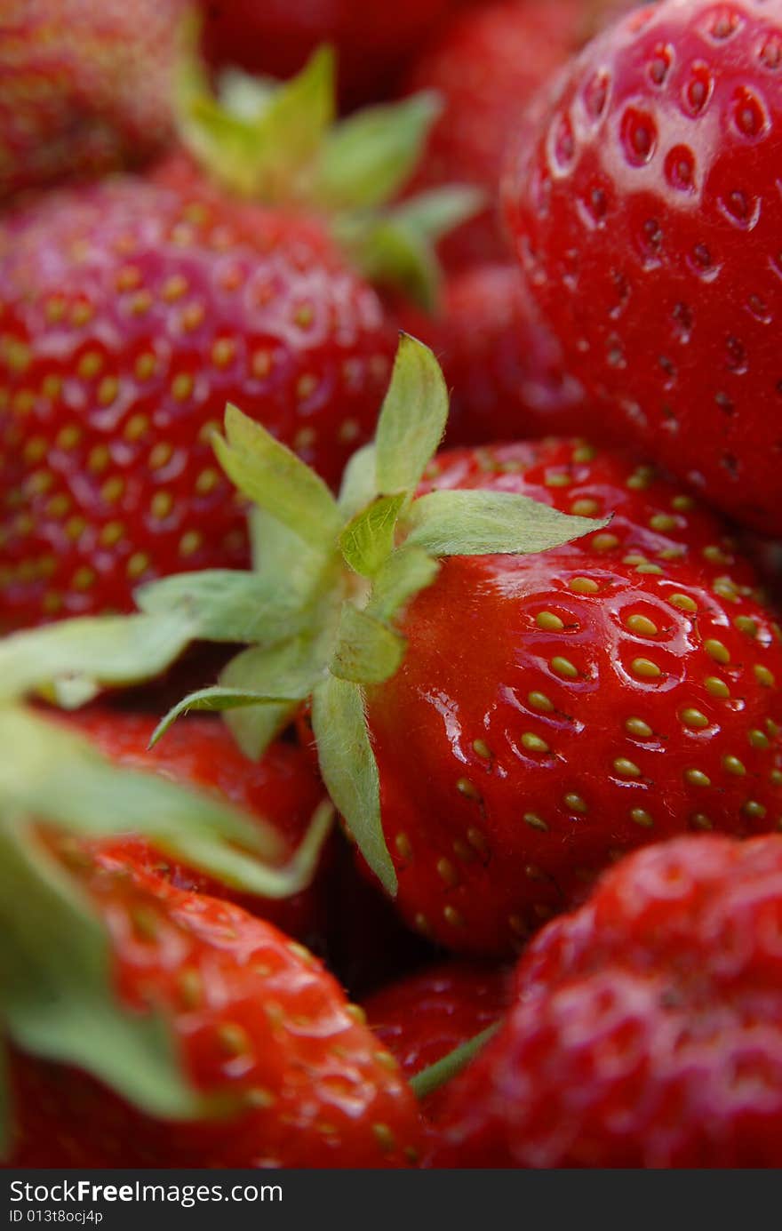 Red ripe juicy strawberries with green sepals