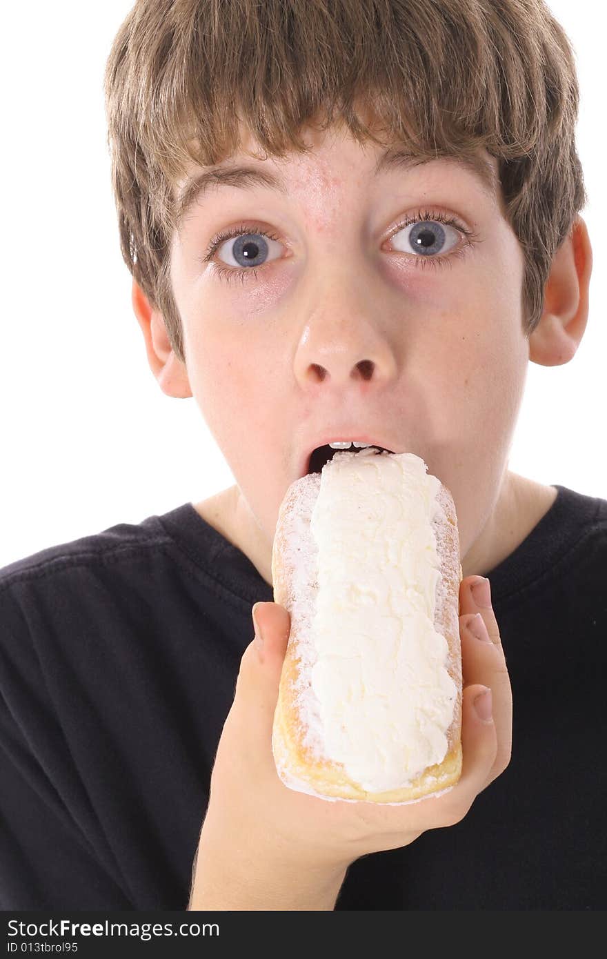 Kid eating a donut isolated on white