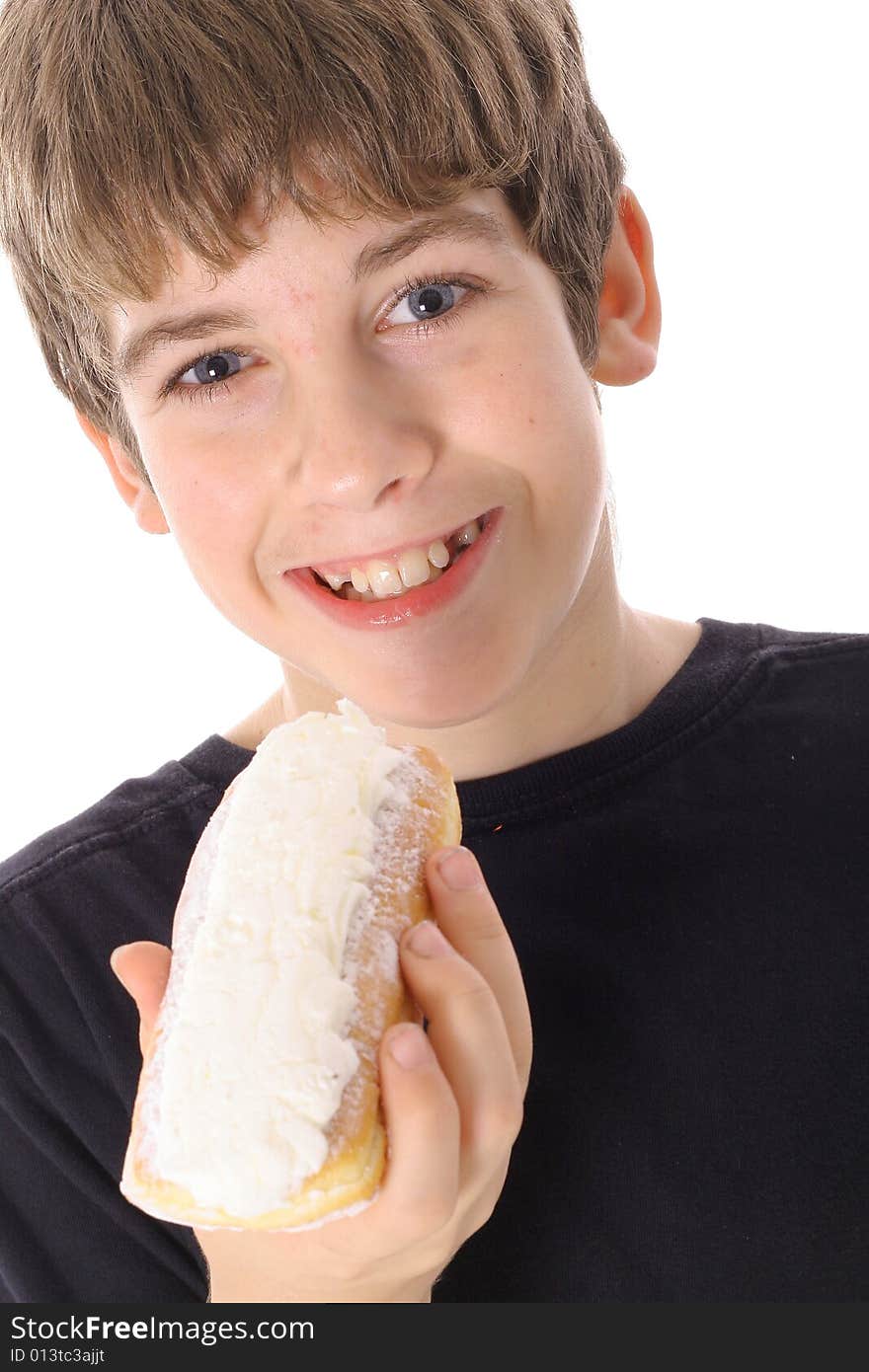 Young boy eating a doughnut