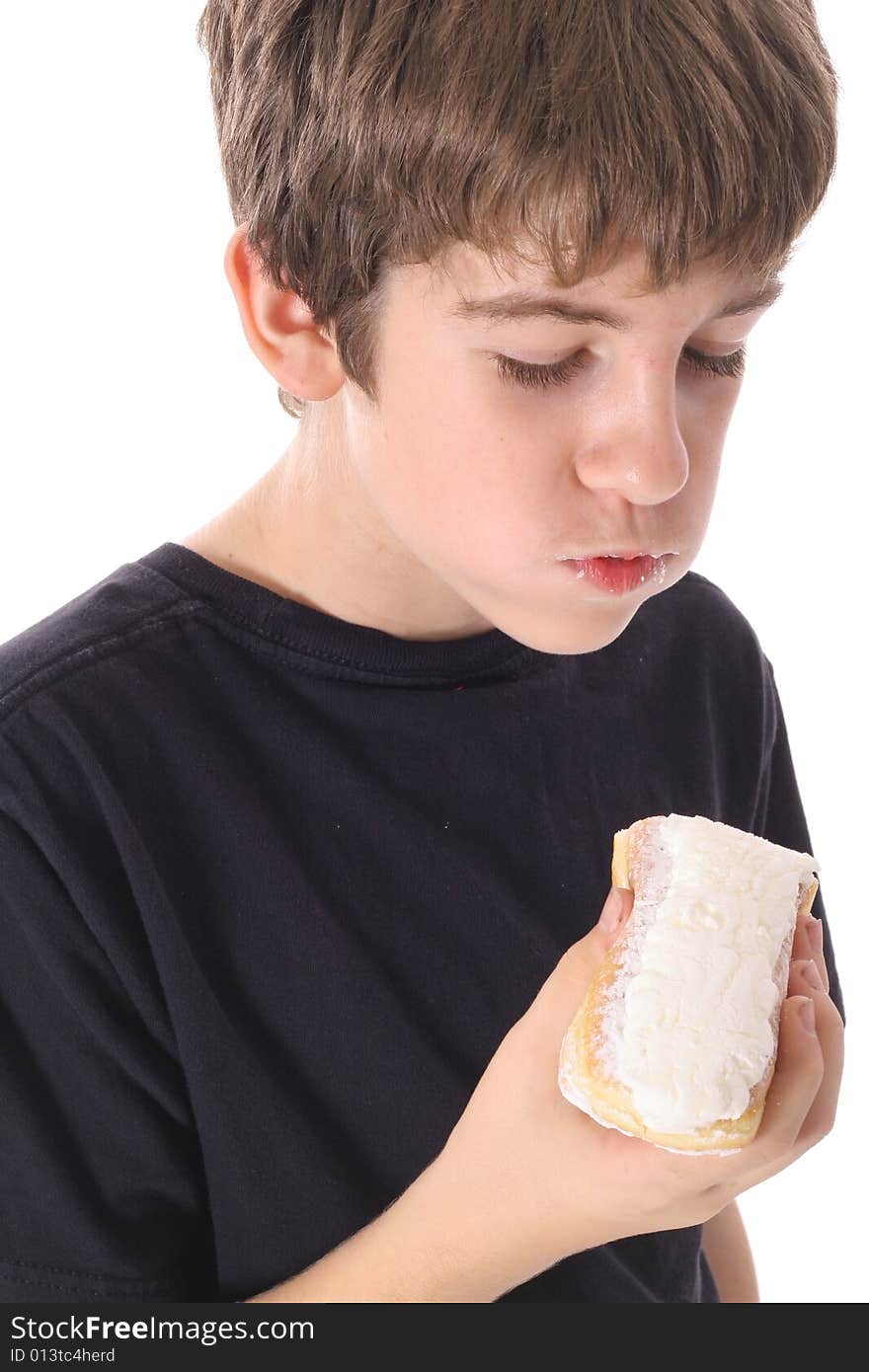 Boy looking at donut isolated on white