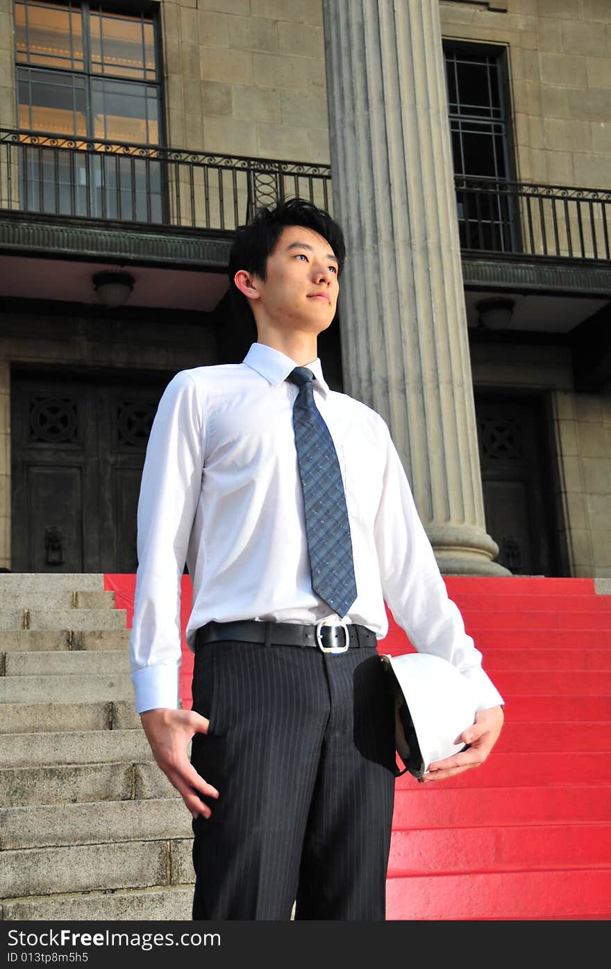 Picture of Asian Guy. Suitable for Job Search, Career Guidance context. He is pictured with an Engineer's hard hat. Picture of Asian Guy. Suitable for Job Search, Career Guidance context. He is pictured with an Engineer's hard hat