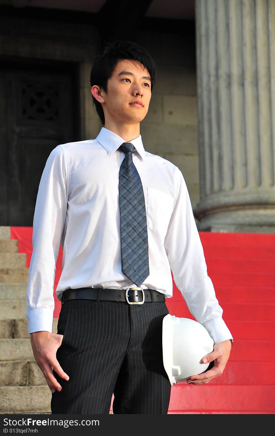 Picture of Asian Guy. Suitable for Job Search, Career Guidance context. He is pictured with an Engineer's hard hat. Picture of Asian Guy. Suitable for Job Search, Career Guidance context. He is pictured with an Engineer's hard hat