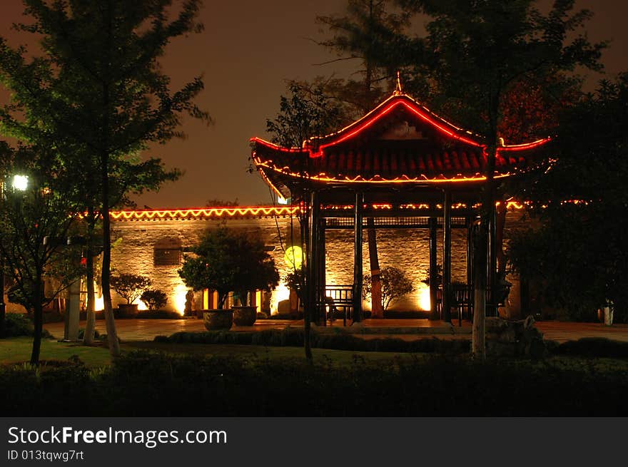 Chinese pavillion in park by night