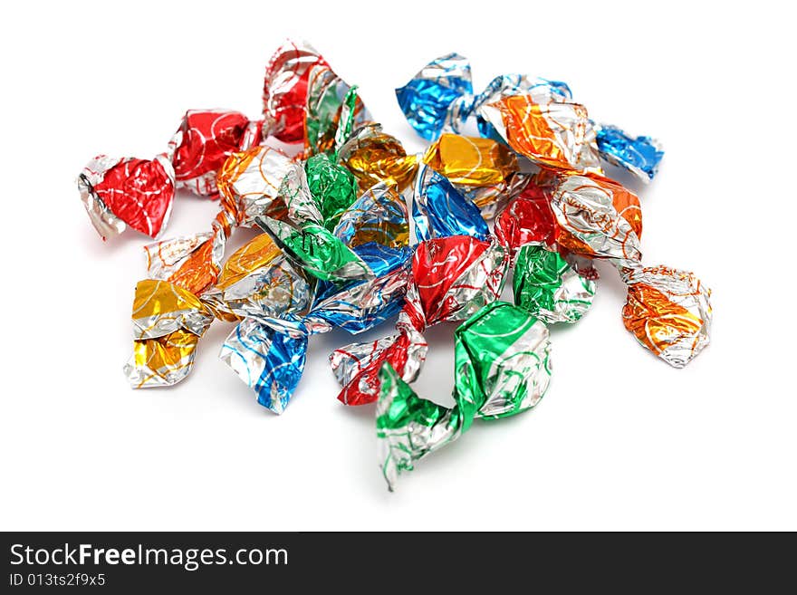 A pile of colorful candies isolated on white background. A pile of colorful candies isolated on white background.