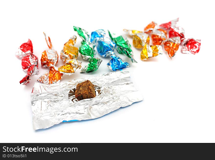 A pile of colorful candies isolated on white background. A pile of colorful candies isolated on white background.