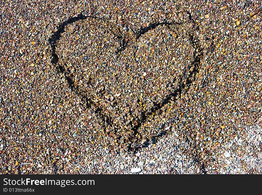 Painted heart on the sand