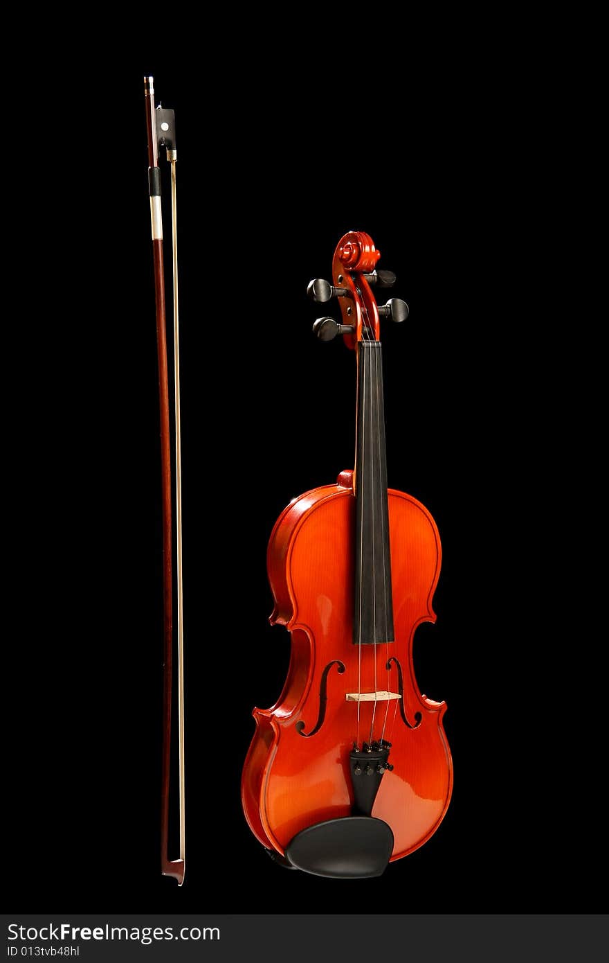 Violin with bow on black