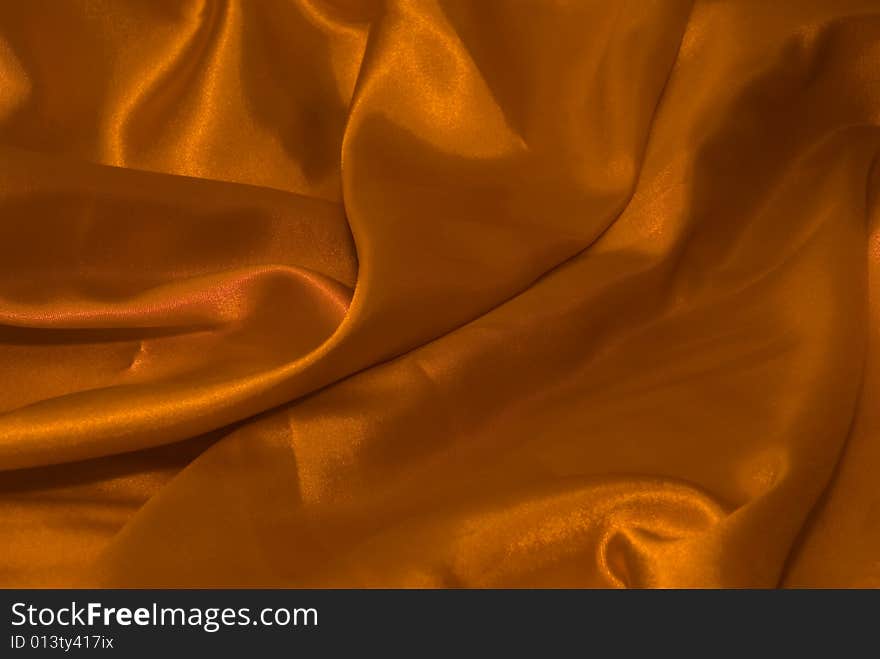 A satin fabric in a sensual and interesting layout - gold color