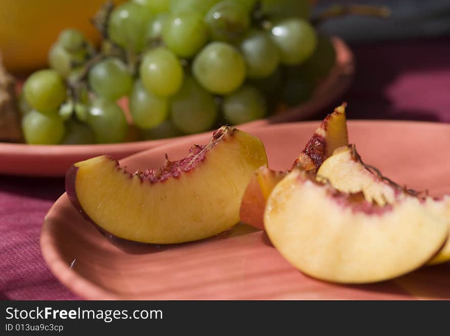 Summer fruits plate - nectarine, grape