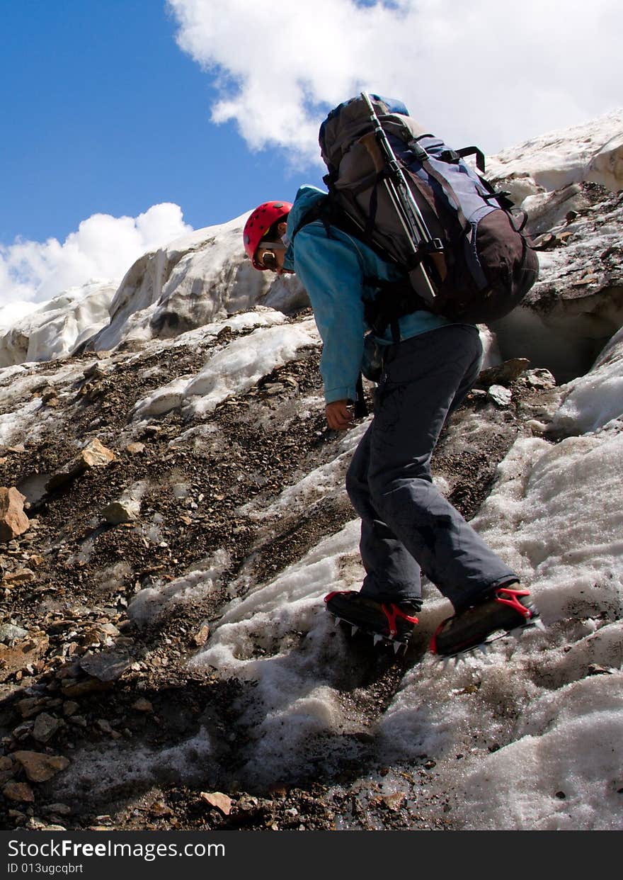 Climber Girl In Crampon With Backpack