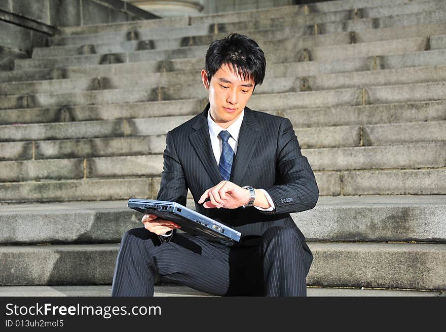 Picture of a Young Successful Looking Executive waiting. Suitable for lifestyle, career type of contexts. Picture of a Young Successful Looking Executive waiting. Suitable for lifestyle, career type of contexts.