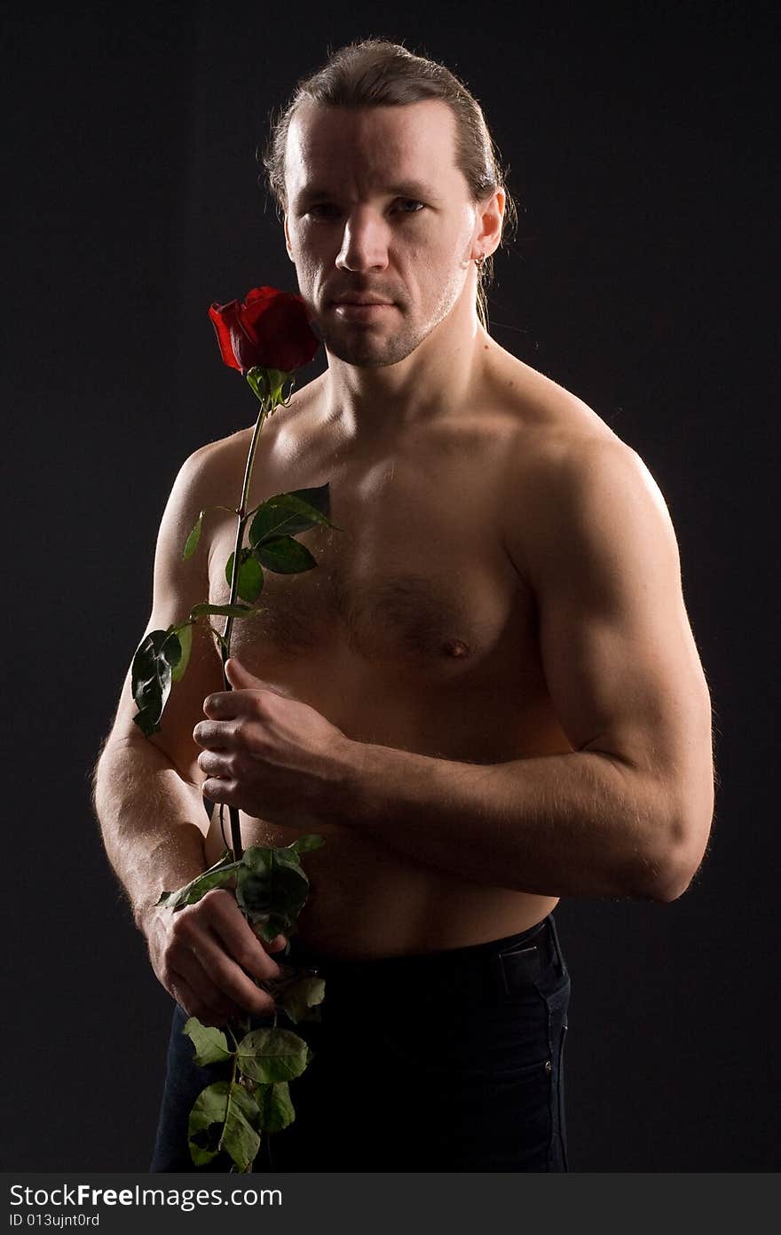 Standing romantic man with red rose. Standing romantic man with red rose