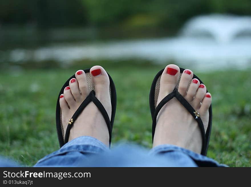 Red toe-nails, woman feet