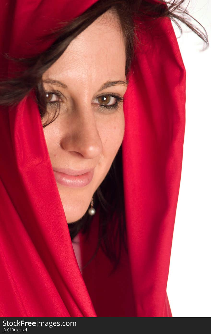 Caucasian young adult woman covering her head with red satin