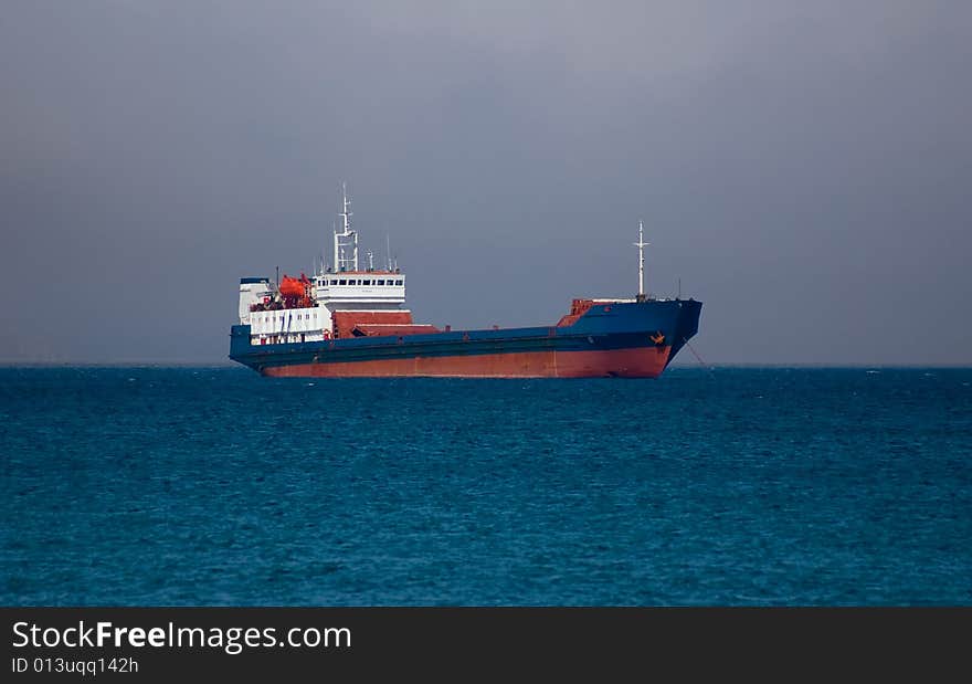 Nave on roadstead before storm on sea