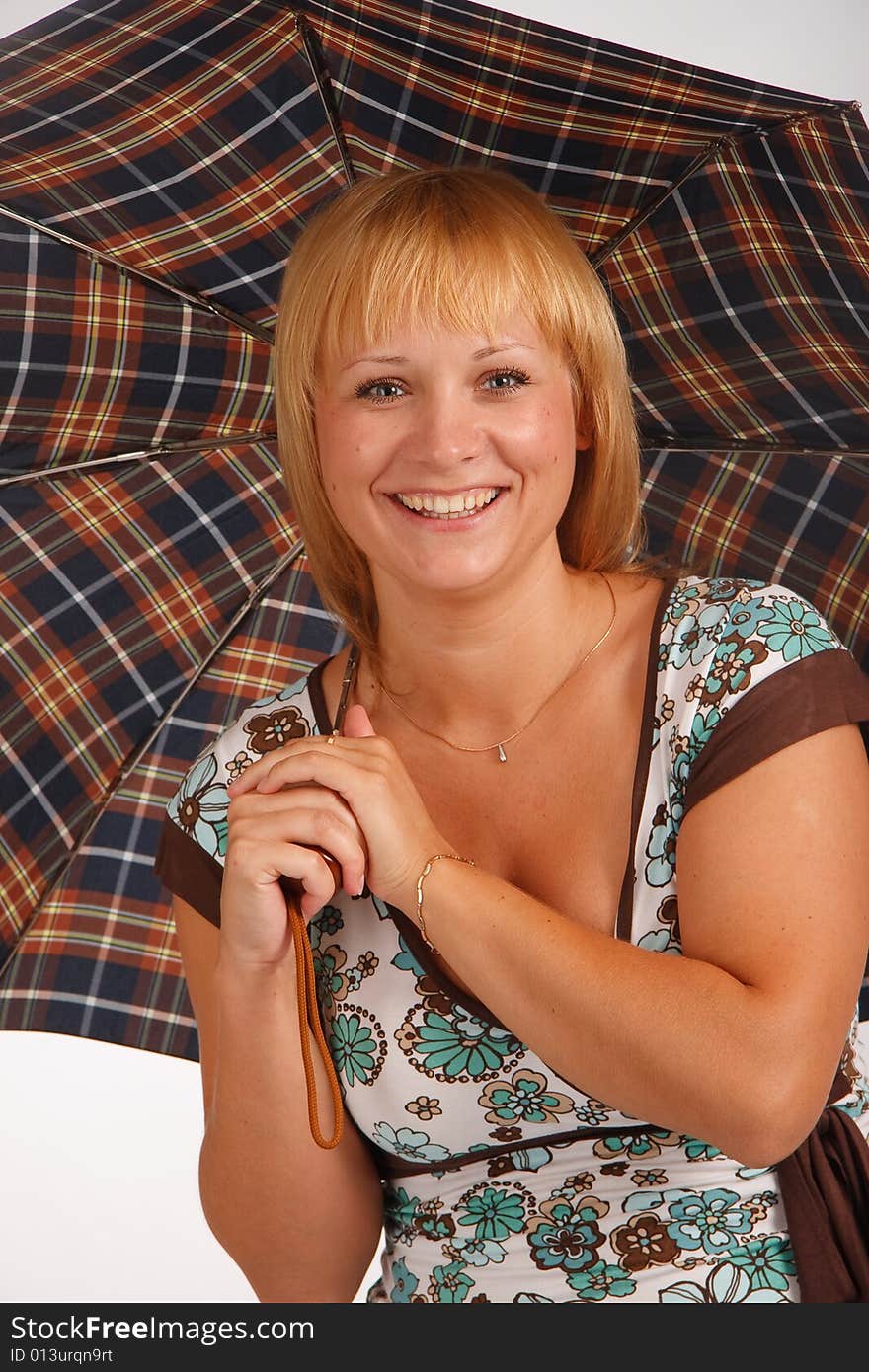 Smiling young girl with umbrella on white background. Smiling young girl with umbrella on white background