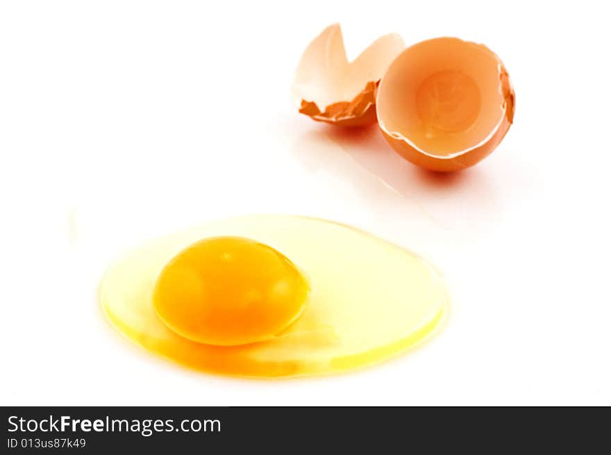 Broken egg on white background with copy space