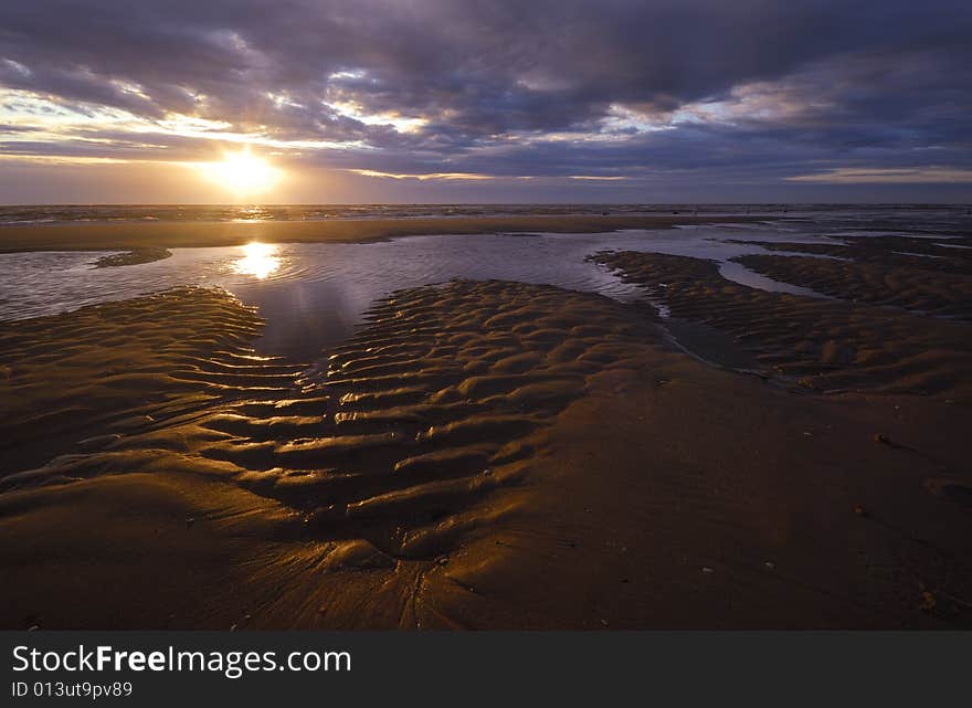 Beautiful sunset and waves on the beach