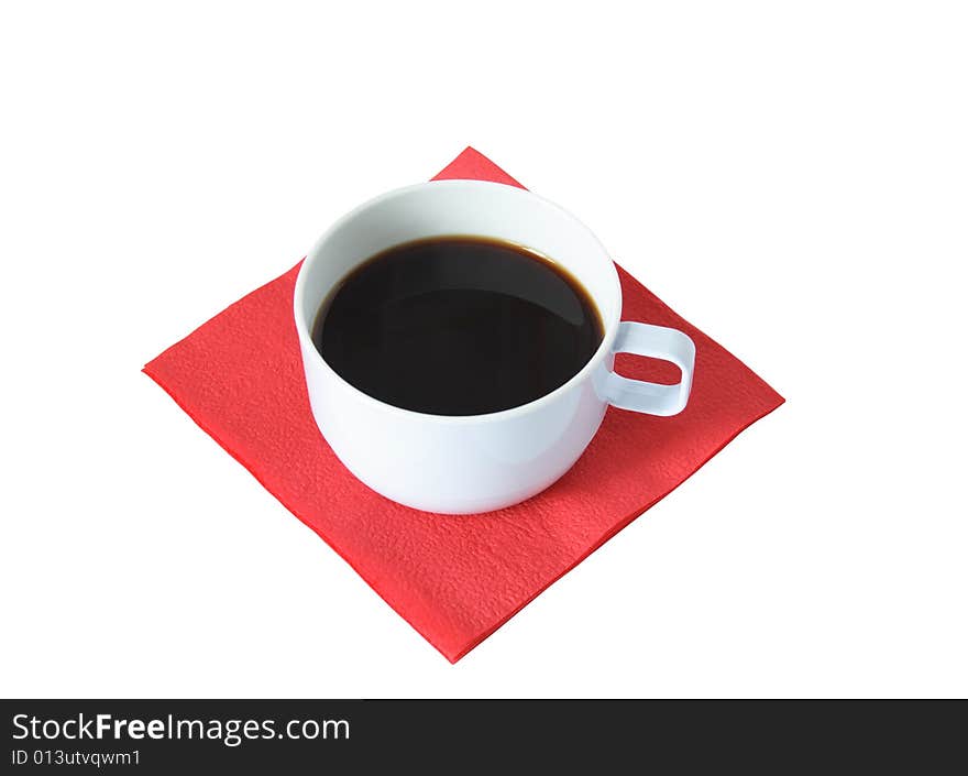 Cup of black coffee standing on red paper napkin on white background