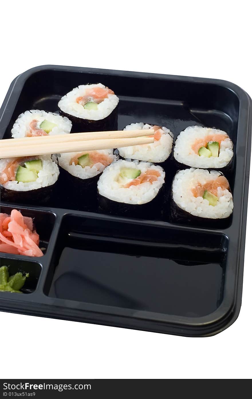 Rolls of sushi on a plate with chopsticks. Rolls of sushi on a plate with chopsticks.