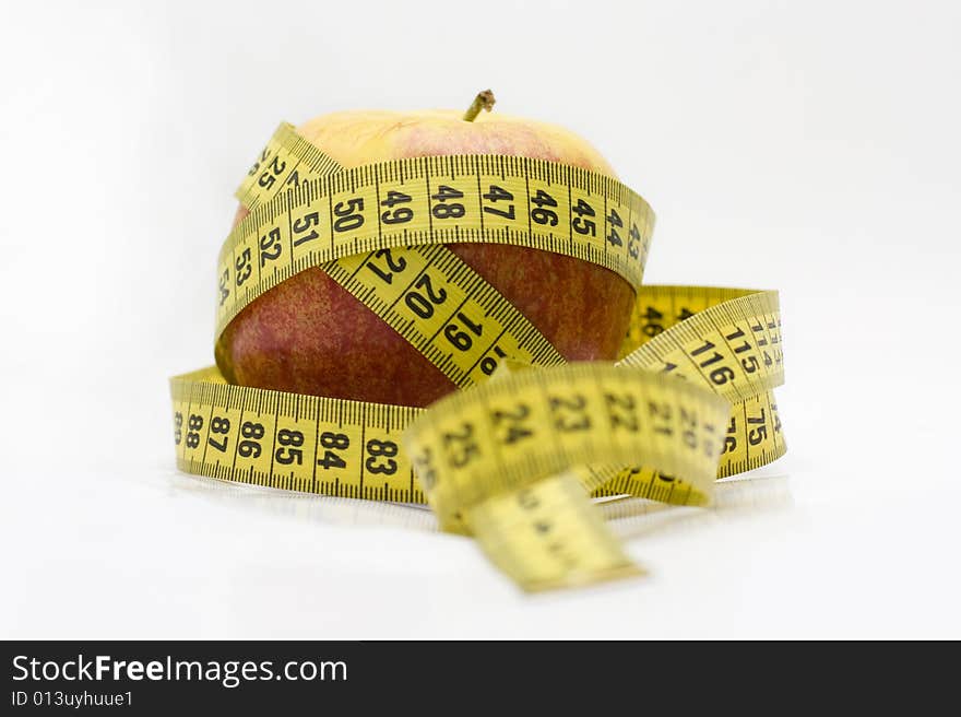 Red apple and tape measure