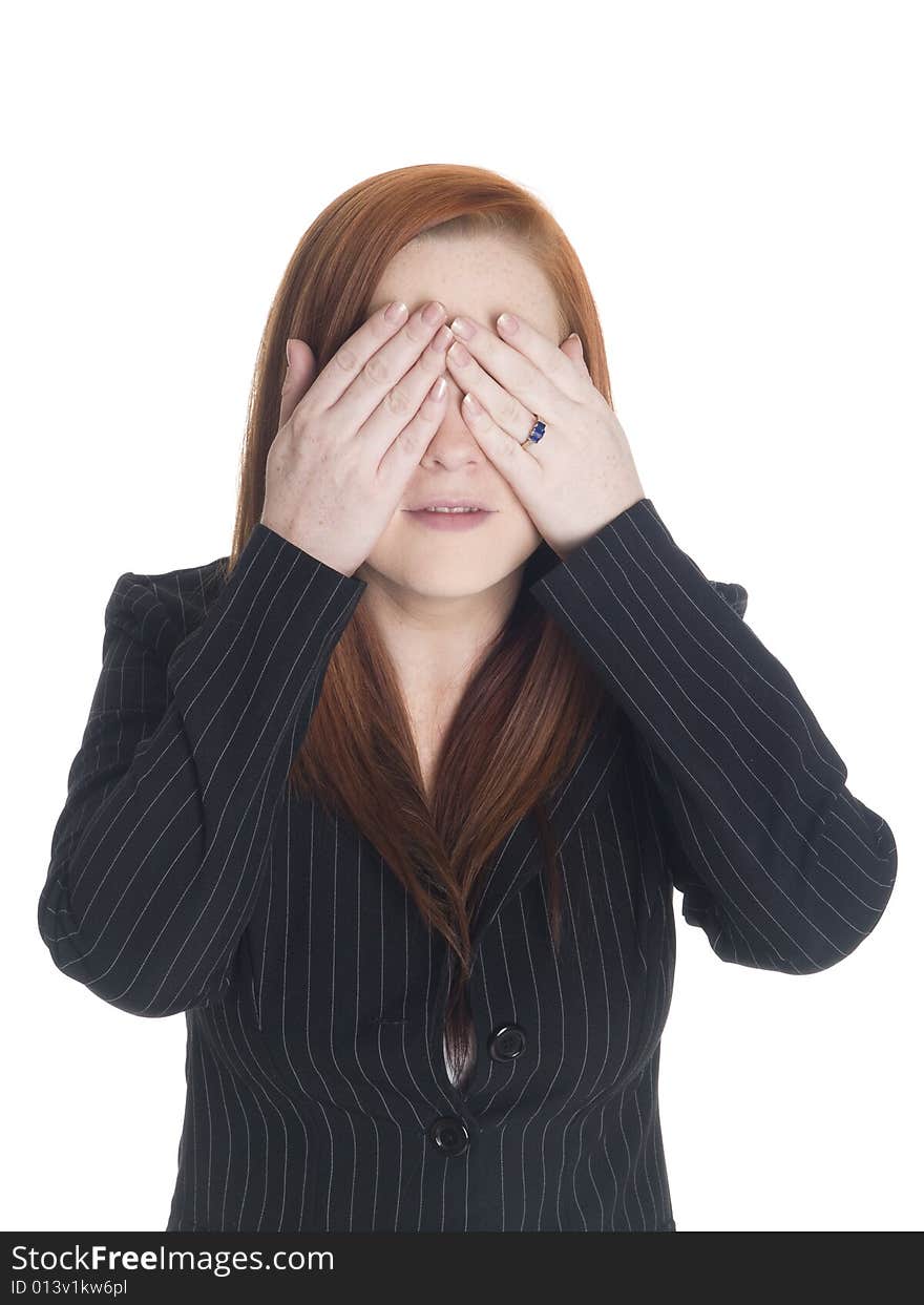 Isolated studio shot of a businesswoman in the See No Evil pose. Isolated studio shot of a businesswoman in the See No Evil pose.