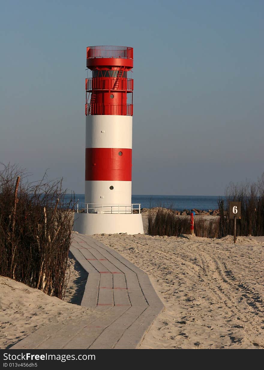 The lighthouse of the Helgoland neighbor island Duene in the german north sea. The lighthouse of the Helgoland neighbor island Duene in the german north sea