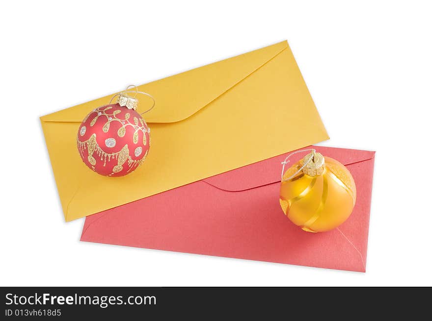 Two envelopes and christmas balls isolated on white background