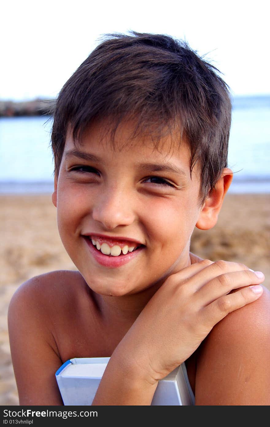 Smiling boy with close book in his hands. Smiling boy with close book in his hands