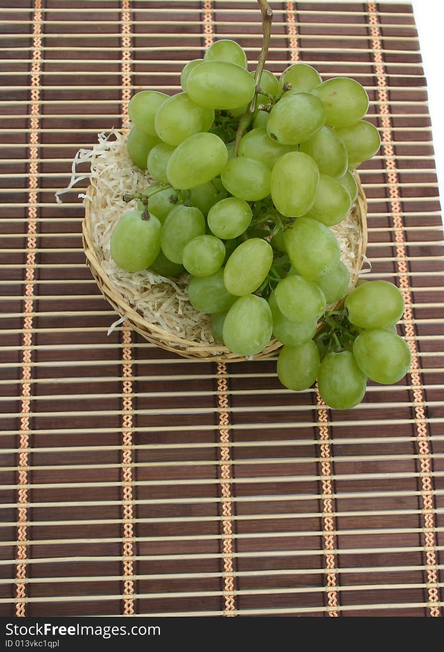 Grapes in a basket on a napkin