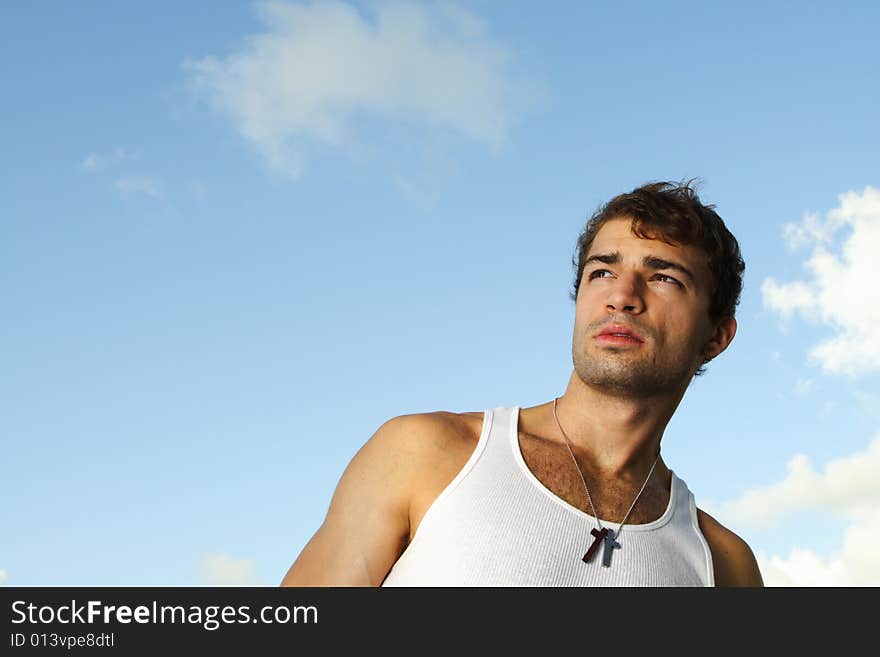 Young man on blue sky