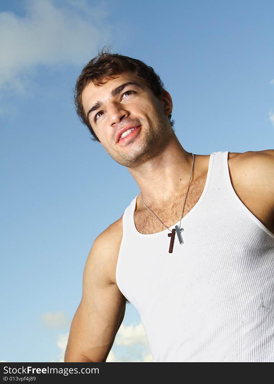 Young man on blue sky